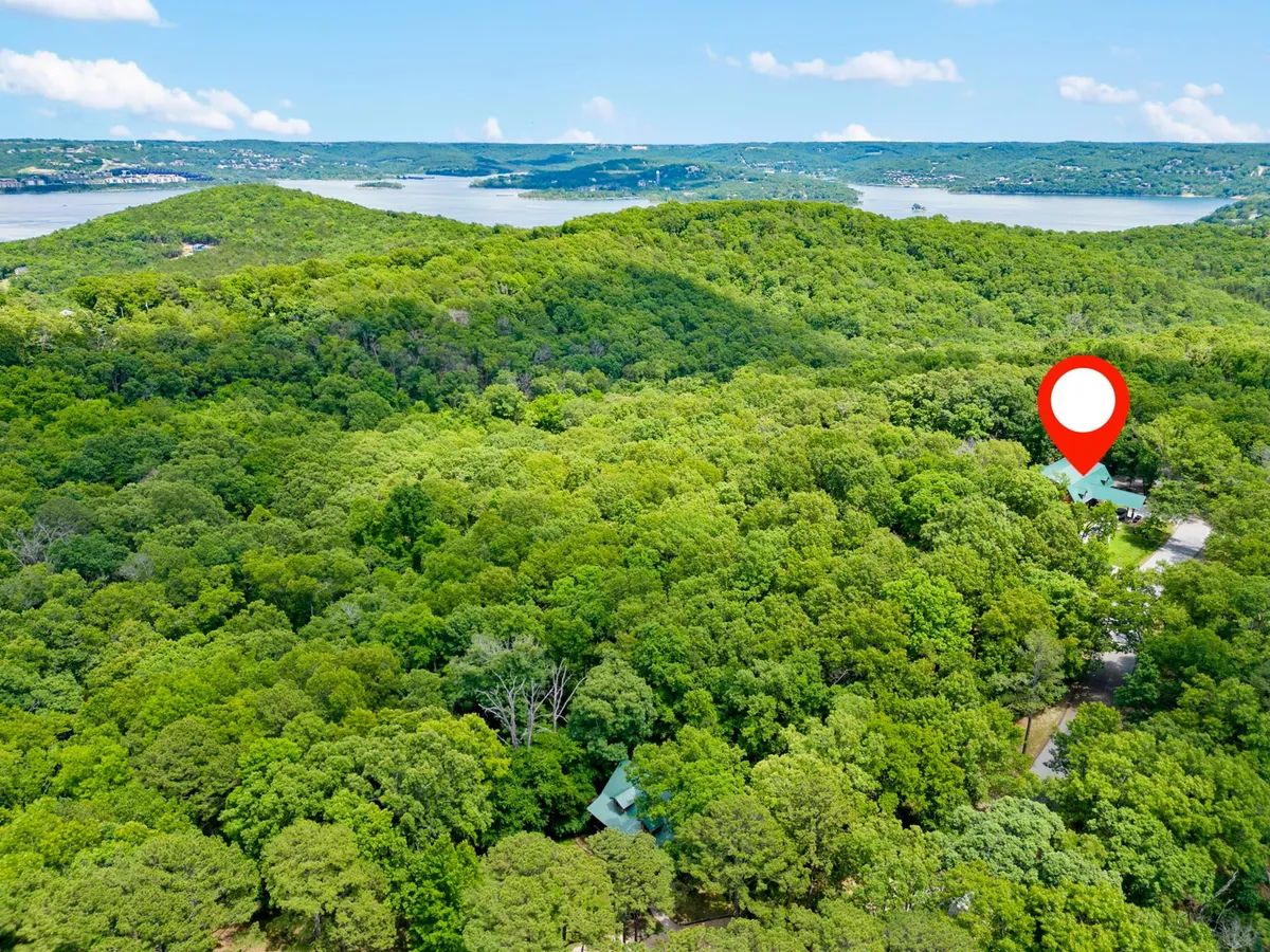 A panoramic view of dense greenery, distant hills, and a shimmering lake, ideal for hiking, bird watching, and relaxing outdoors. The landscape demonstrates the estate’s harmonious relationship with its natural surroundings and offers a sense of adventure for eco-conscious travelers.